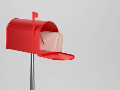 A red mailbox on a white background.