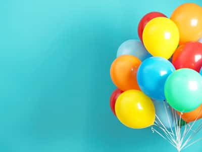 Colorful balloons on a blue background.